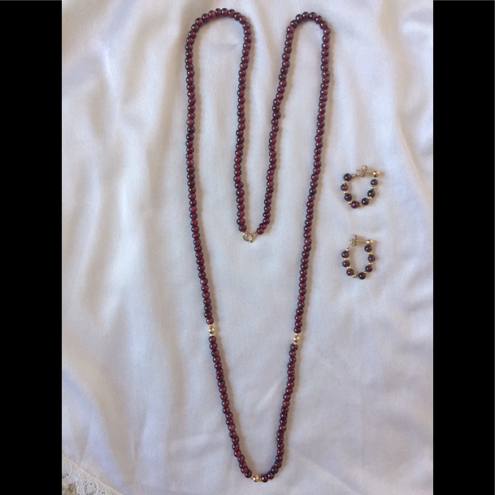 Women’s garnet necklace and earrings